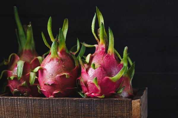 dragon fruits on a wooden case