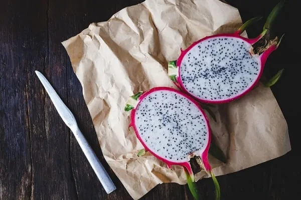 a slice of dragon fruit on a paper